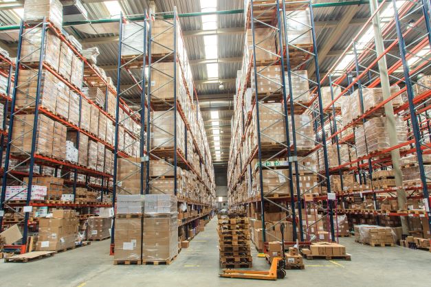 Boxes stacked high in a warehouse