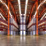 Warehouse industrial and logistics companies. Commercial warehouse. Huge distribution warehouse with high shelves. buying a warehouse