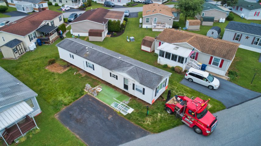 An aerial view of many mobile homes with driveways